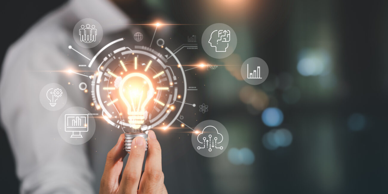 Illustration of a light bulb surrounded by interconnected icons representing how workforce systems collaborate effectively.